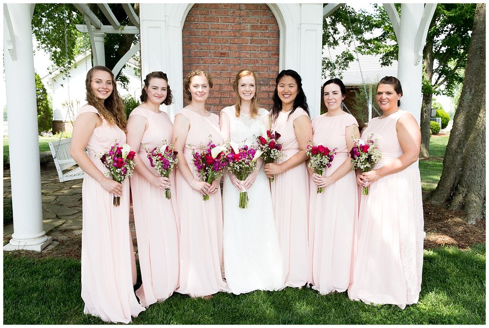 bridesmaids in light pink dresses