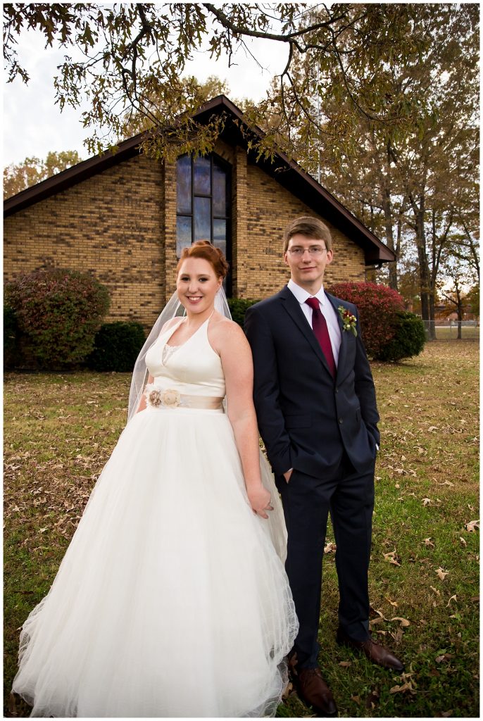 Bride and groom in front of the church