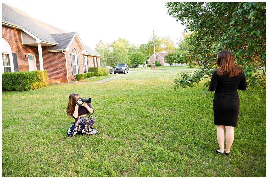 a woman photographing another woman