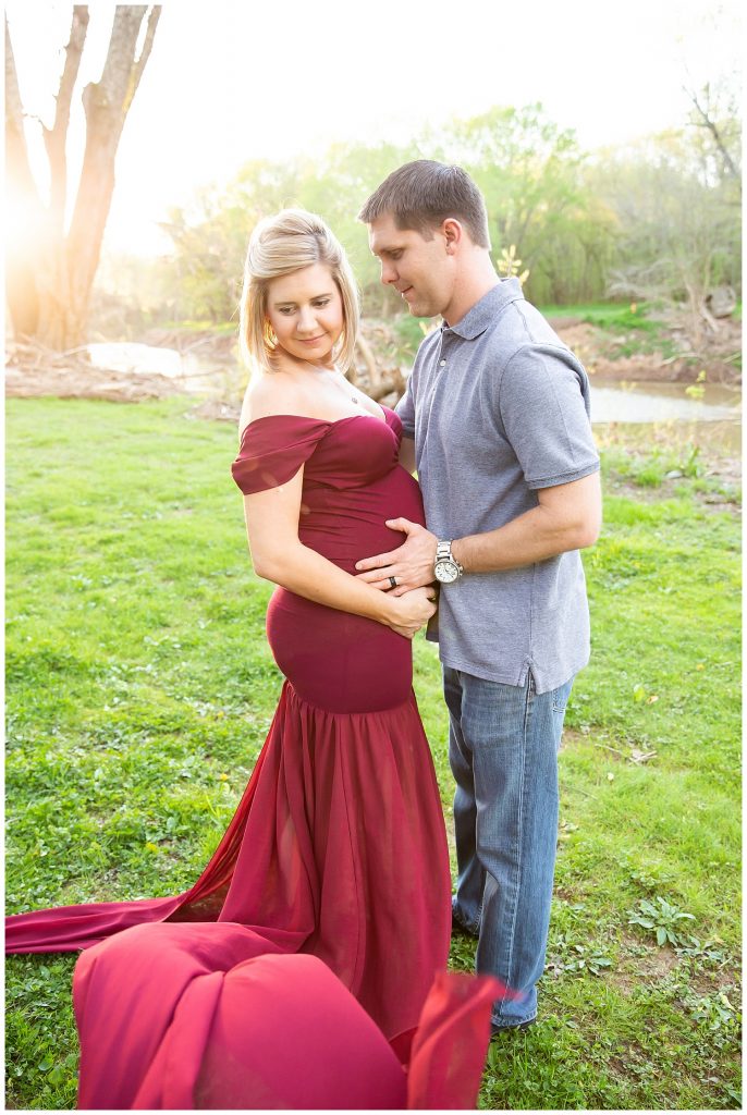pregnant woman looking over shoulder, man looking at woman