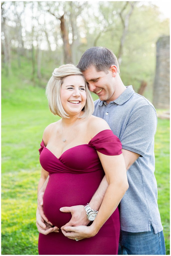 pregnant woman and man laughing