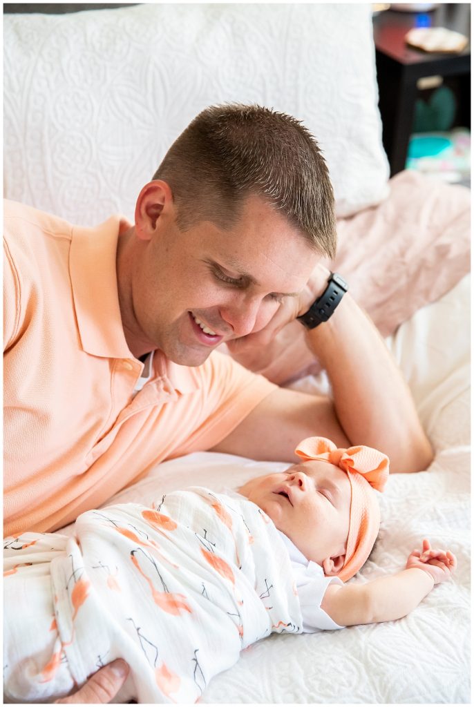 dad and baby girl on bed