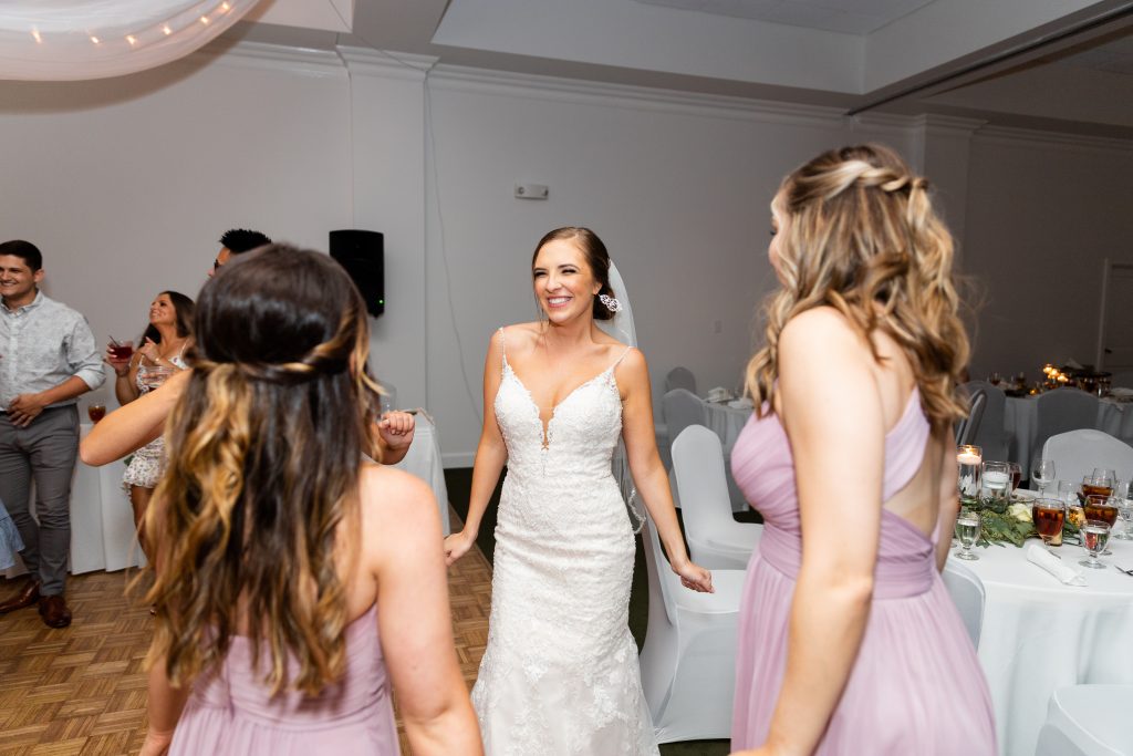 Bride-dances-with-bridesmaids-reception-party