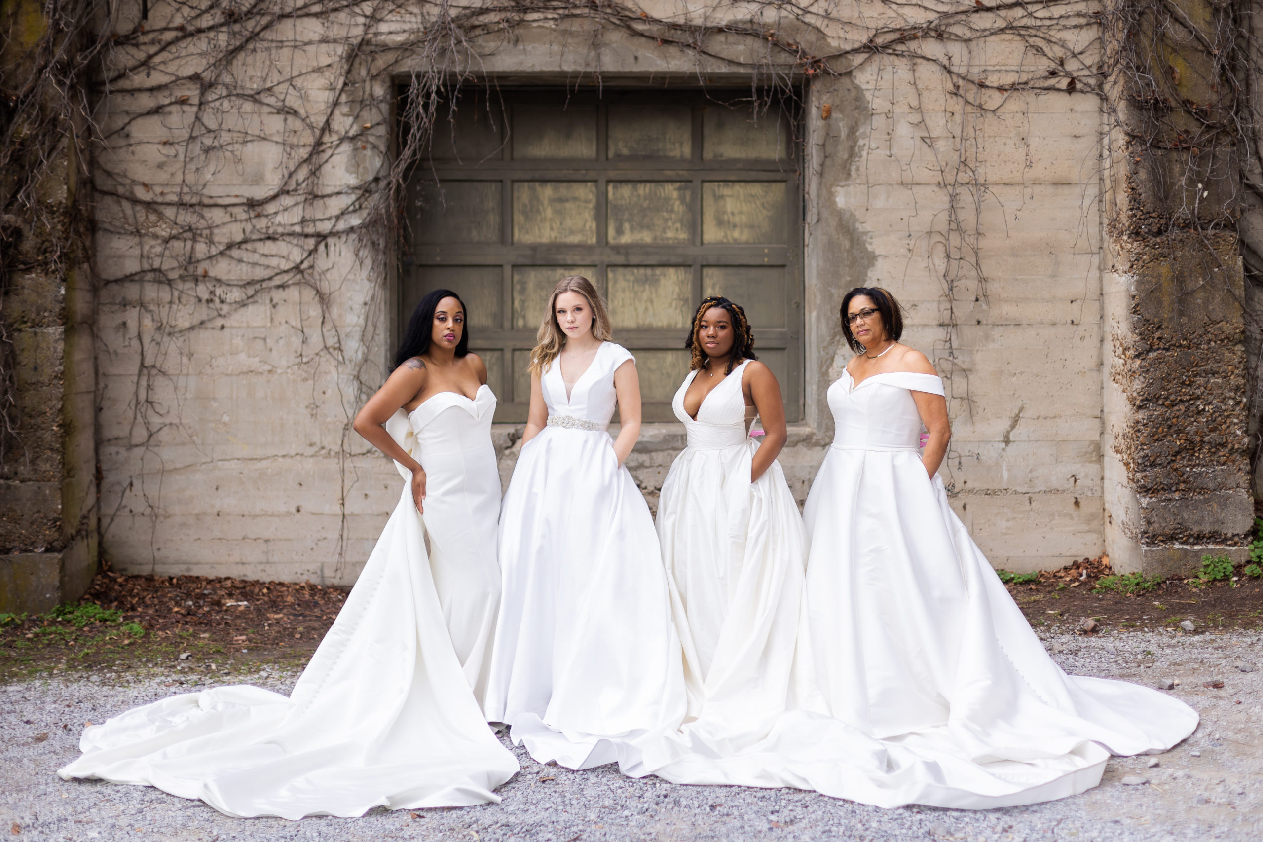 Four beautiful women modeling wedding gowns in Downtown Clarksville, TN.