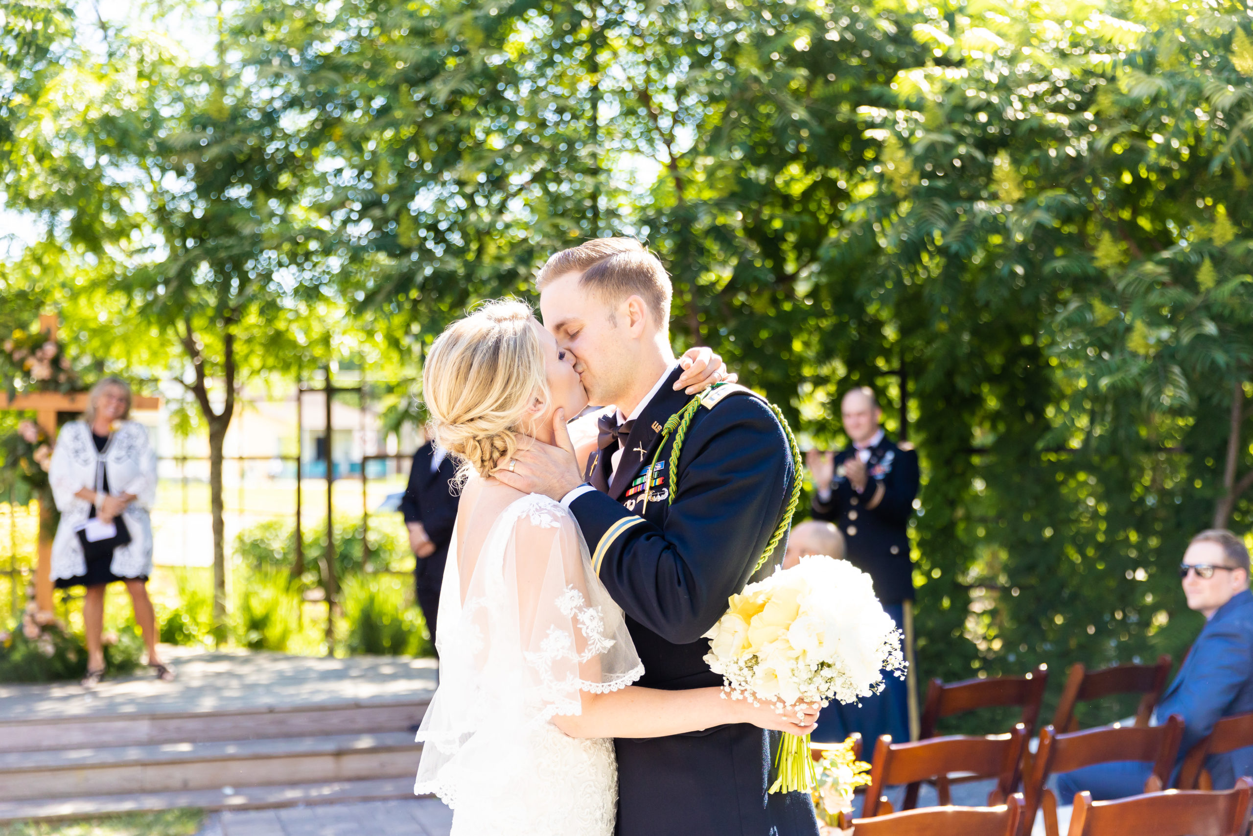 bride and groom kissing during ceremony