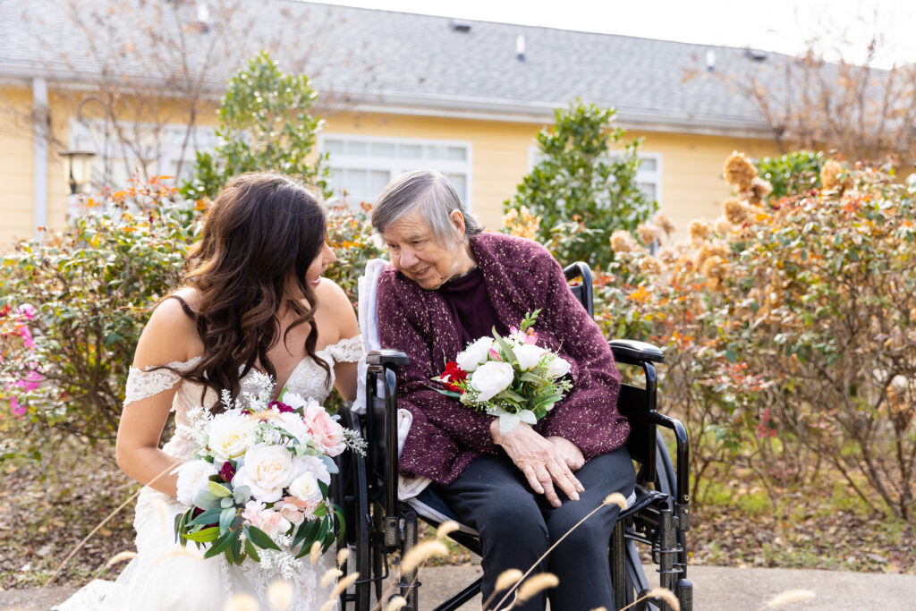 A bride smiles at her grandmother.